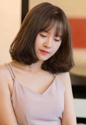 Kiểu tóc ngang vai xoăn lơi